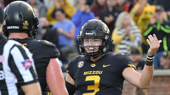 Lock throws for four TDs, runs for another in Mizzou's 40-13 win over Wyoming