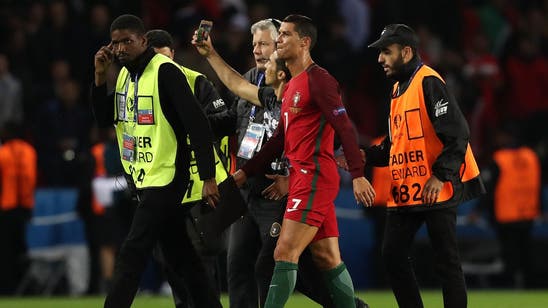 Portugal escape punishment after Ronaldo selfie pitch invader