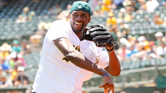 Warriors' Ezeli visits A's, tosses out ceremonial first pitch