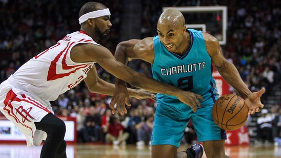 Hornets' Gerald Henderson dons cap and gown next to Duke's Quinn Cook