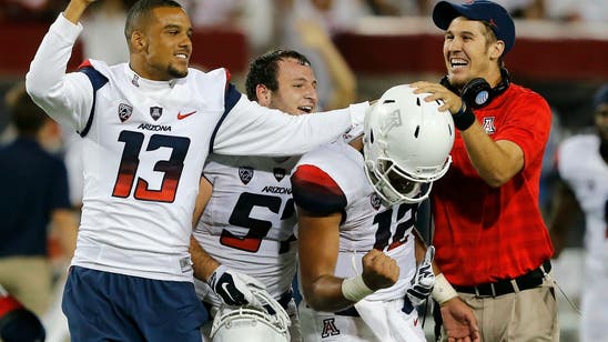 Arizona enters Grambling State game with questions at QB