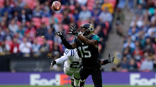 Jaguars withstand late rally, beat Colts in London for first victory