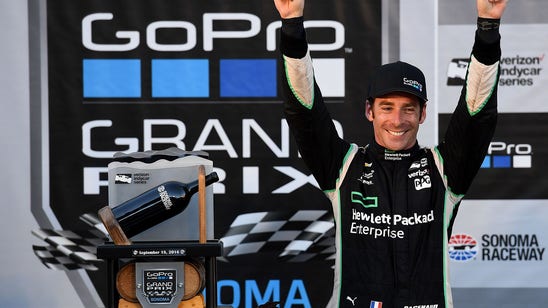 IndyCar champion signs his toy cars on sale at airport