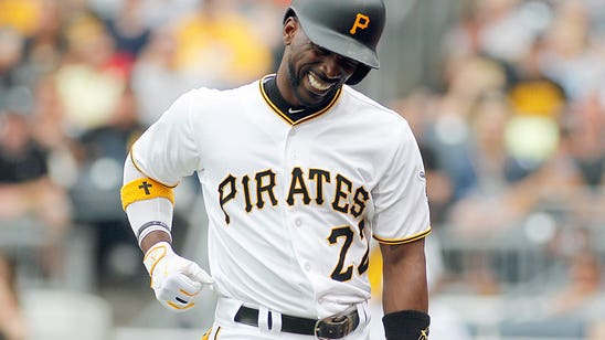 McCutchen injured when pitch hits elbow, but Pirates top Braves