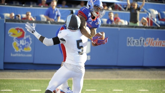 Kansas fans storm field after defeating FCS school, told to stop for 'respect of program'