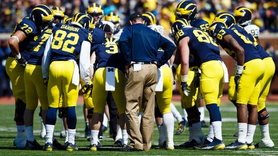 Harbaugh passing test with former Wolverines