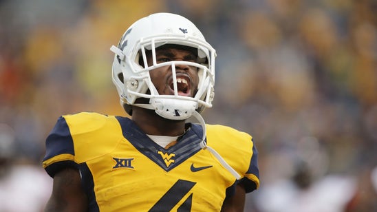 Howard's 3 TD tosses leads WVU over Liberty