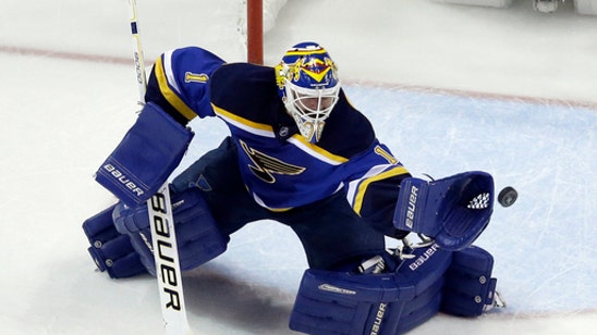 Flames acquire goalie Elliott from Blues for 2nd-round pick