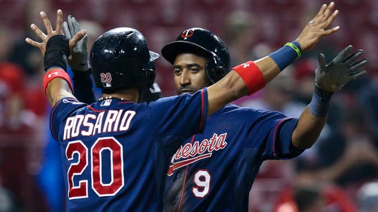 Twins beat Reds 8-5 after long weather delay