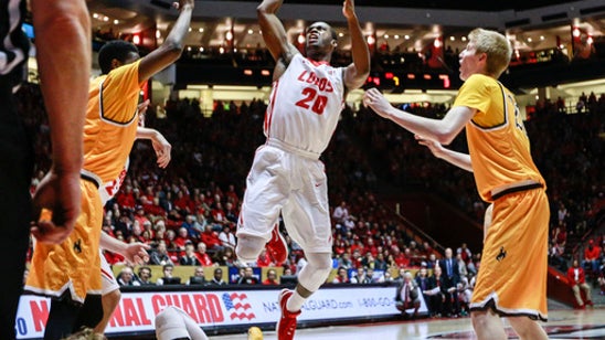 Wyoming holds off New Mexico 70-68