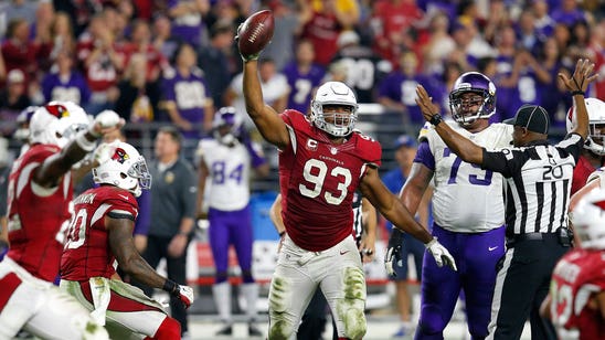 Cardinals turn back Vikings with late sack