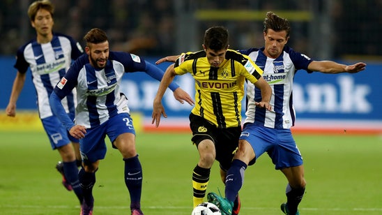 Aubameyang helps Dortmund draw Hertha Berlin; both end with 10 men