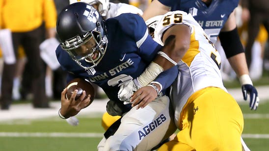 Utah State rolls Wyoming 58-27 for 13th straight home win