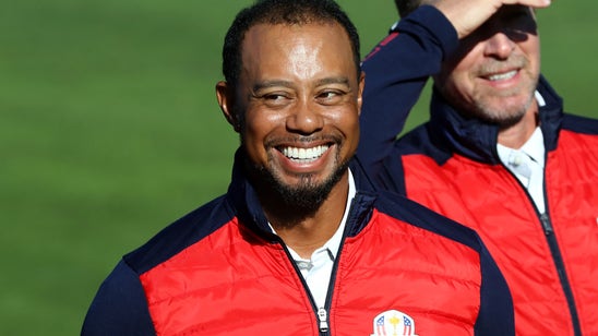 Watch Tiger Woods get kicked out of a Ryder Cup team photo