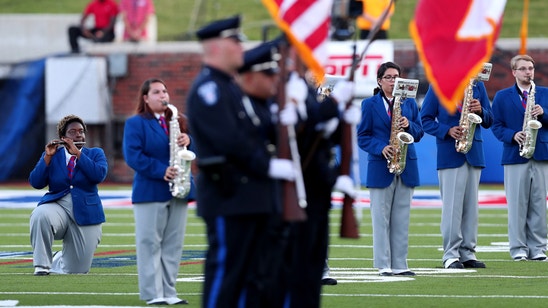 SMU band members kneel in protest during national anthem