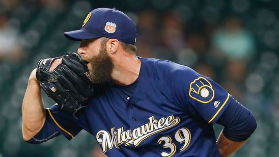 Brewers shuffle relievers on opening-day roster