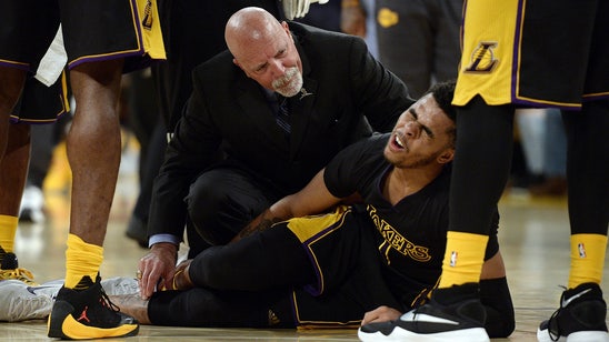 Lakers rookie D'Angelo Russell carried off the court after spraining ankle