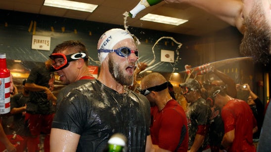 Bryce Harper sports Katie Ledecky swim cap during Nationals' NL East title celebration