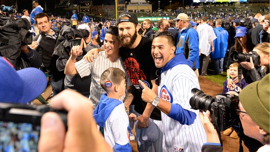 Kid with Jake Arrieta's face shaved into his head celebrates with Jake Arrieta