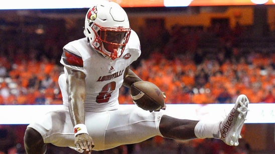 Watch Louisville's Lamar Jackson hurdle a defender in a 5-TD performance
