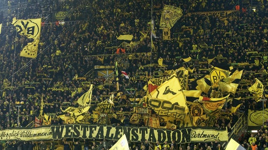 Borussia Dortmund’s supporters go silent after fan dies during match