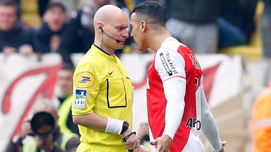 10-man Monaco beats local rival Nice to keep second place