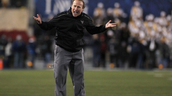 WATCH: W.Va. coach Holgorsen crowd-surfs after beating Texas