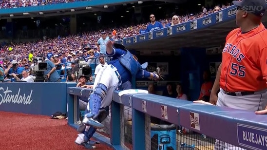 Russell Martin lunges into Astros dugout for impressive catch