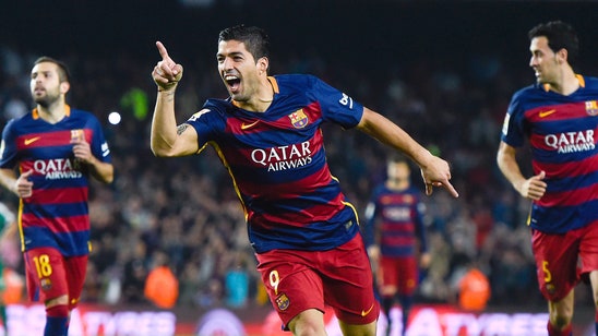 Suarez's hat-trick carries Barcelona over Eibar