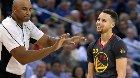 Curry scores 35, Warriors beat Rockets for 42nd straight home win