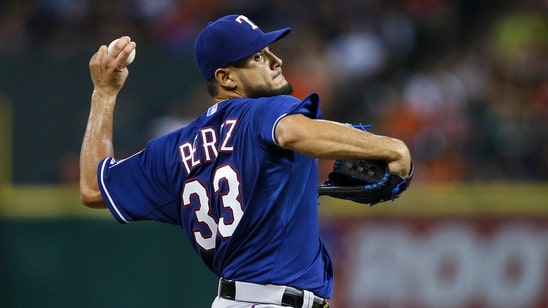 Rangers collect 15 hits, lose to Astros in Perez's return