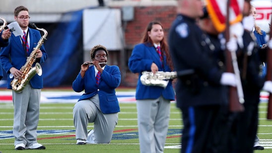 SMU band members knelt during the national anthem before the TCU game