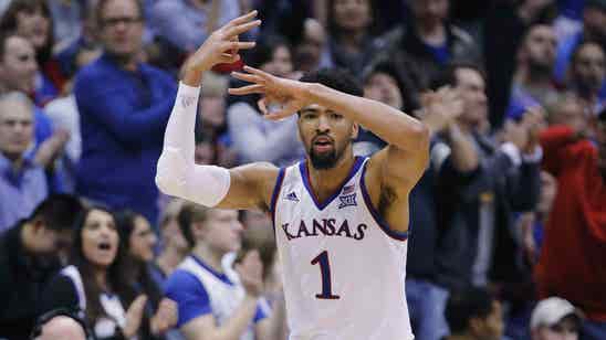 Lawson does it all to lift No. 7 Kansas past No. 25 TCU 77-68