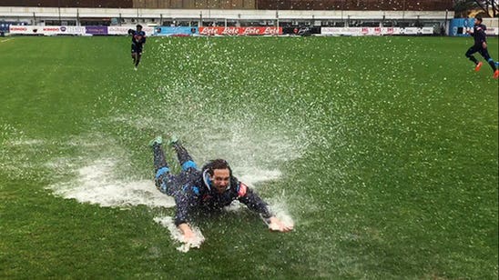Napoli players can't resist playing in puddle at training
