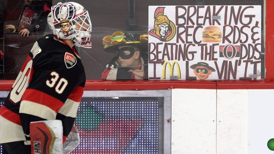 Fans toss burgers at goalie again, only this time one gets eaten