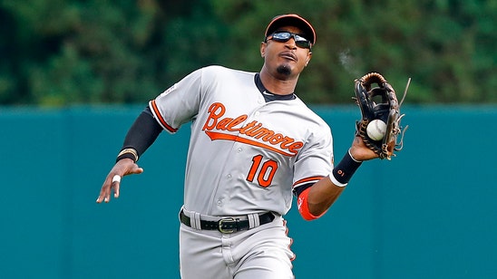 Orioles' Adam Jones gives pointers to Red Sox' Mookie Betts on defense