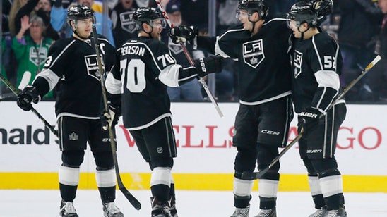 Kings clinch playoff spot with 2-1 win over Bruins