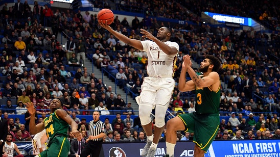 FSU withstands a 3-point barrage to hold off Vermont in 1st round of NCAA Tournament