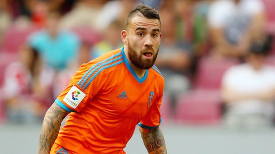 Valencia trying 'everything possible' to keep star defender Otamendi