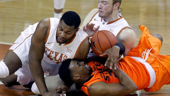 Texas holds on to beat Oklahoma State 74-69