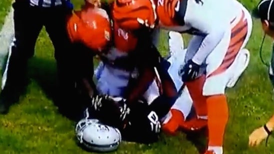 Adam Jones slams Amari Cooper's head off helmet