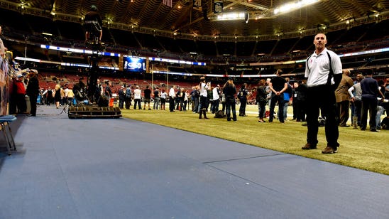 Rams cover concrete with rubberized surface at stadium