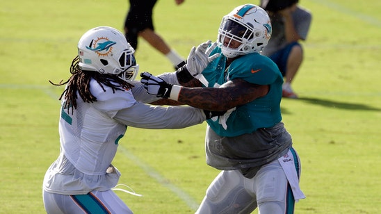 Dolphins center Mike Pouncey isn't worried after leaving game with knee injury