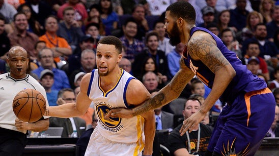 Curry flirts with triple-double, Warriors down Suns