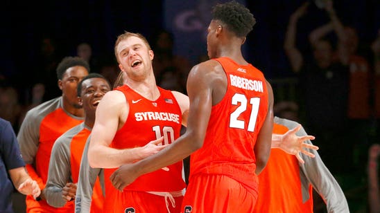 Syracuse's Tyler Roberson finishes an acrobatic alley-oop