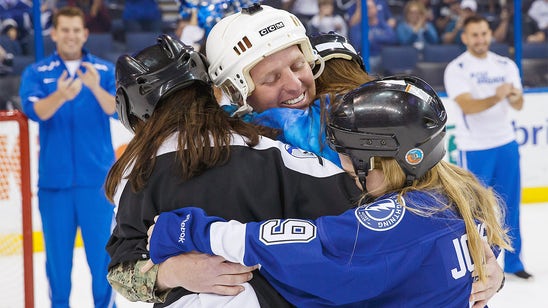 Daughters surprised by Navy dad's return at Lightning game (VIDEO)