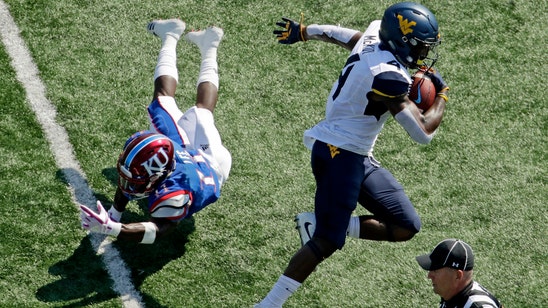 Herbert's big day goes for naught in Jayhawks' 56-34 loss to West Virginia