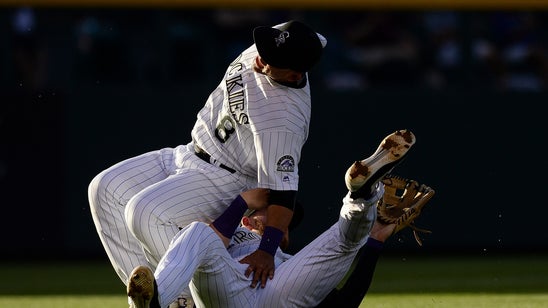 Gerardo Parra suffers scary leg injury after Trevor Story dives into him