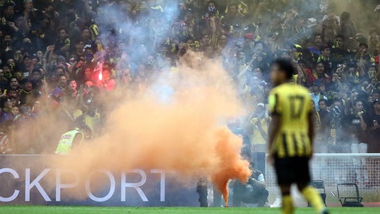 Malaysia's WCQ with Saudi Arabia suspended over flares on field