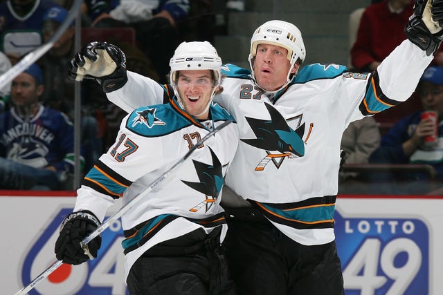 Los Angeles Kings' Jeremy Roenick, right, collides with Nashville